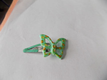 Green butterfly with orange/yellow flowers painted on metal hair clip