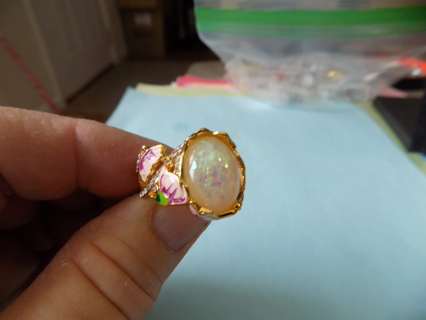 Ring # 16 goldtone has 3/4 inch stone and pink enamel flowers & butterflies 2 bands to 1