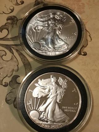 2 oz silver.....one am eagle coin and one round.  both in deluxe capsules