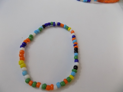 Multi colored E beads bracelet on stretchy cord