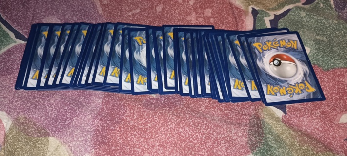 50 random Pokemon cards and 50 sleeves 