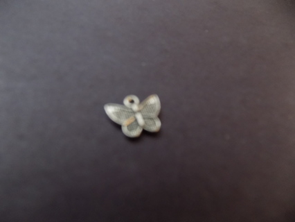 Silvertone butterfly charm with open wings and metal dots