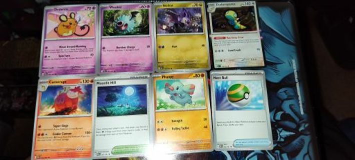 8 mint condition Pokemon Cards