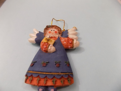 3 inch resin angel ornament blue and rust color gown holding present