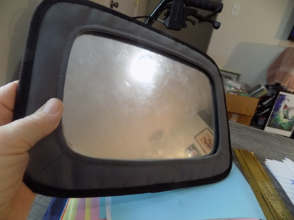 Baby watcher mirror fits over cars visor to see baby in back seat