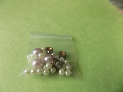 Small bag of white pearl and pink pearl beads & 4 rhinestone separators