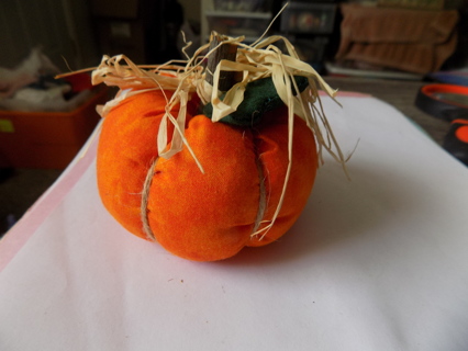 3 inch round # 6 solid orange pumpkin, raffia, wood stem, fabric leaf