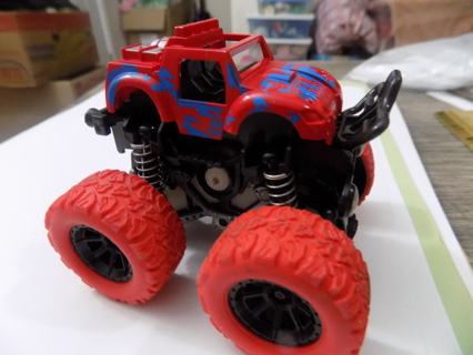 3 inch tall red Monster truck red tires trim in blue on springs