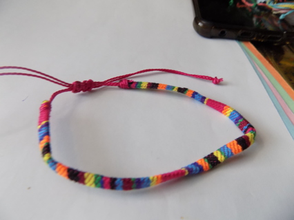 Bracelet woven threads multi color bright orange, yellow, green fuschia