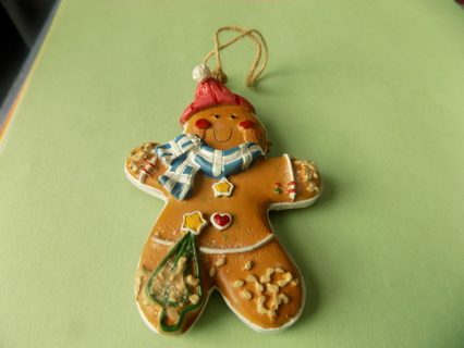 4 inch resin gingerbread boy ornamnet in red knit hat, blue& white scarf tree on foot