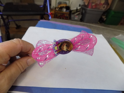 Disney's Tangled head band.  Has the princess and large pink bow