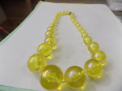 Necklace large yellow see through beads in graduating sizes