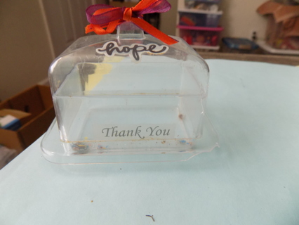 Acrylic butter dish shape ornament says Hope, and has red ribbon 3 inch wide