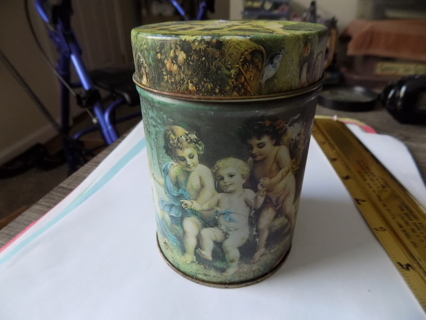 4 1/2 tall and 3 inch wide green tin covered in angel cherubs