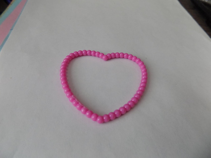 Childs pink plastic heart shape bracelet