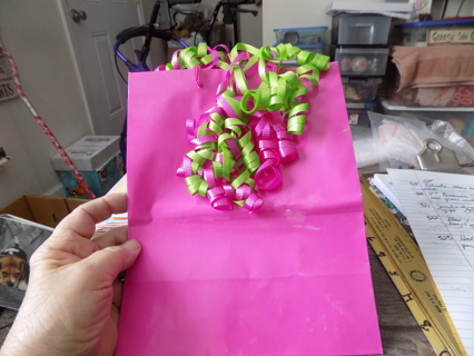 Hallmark hot pink gift bag with large green & pink curly ribbon bow attached