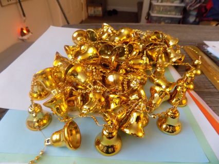 Several yards of golden plastic bells and beads garland