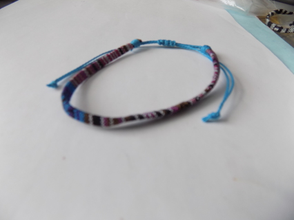 Bracelet adjustable woven light blue, purple black, white