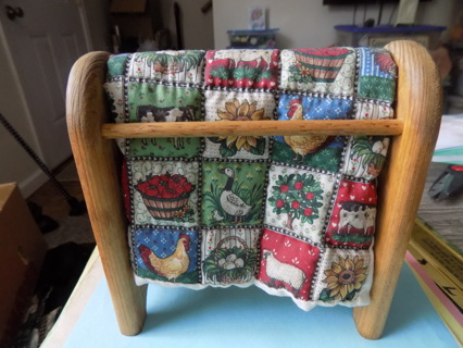 6 inch tall and wide handmade wood miniature quilt rack with homemade mini quilt over it