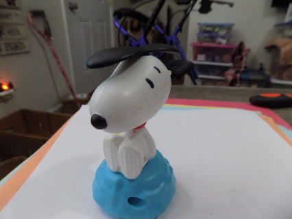 Vintage Snoopy rolling toy his ears move around like propellers when he is rolled