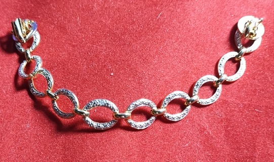 LADIES DIAMOND BRACLET STERLING SILVER LAYERED IN SOLID GOLD 7.25 INCHES LONG 1/2 INCH WIDE 