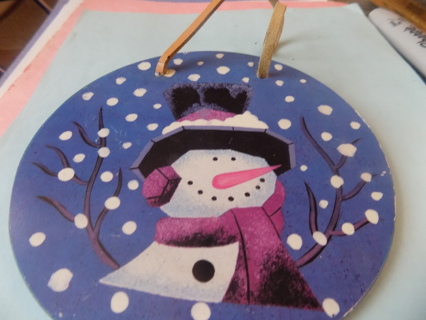 6 inch round plate size handpainted snowman on glass, blue background and snowflakes