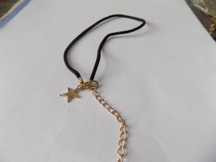 Black cord choker necklace with gold star charm and extension chain