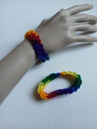 Rainbow yarn bracelet. New. Crocheted by me.