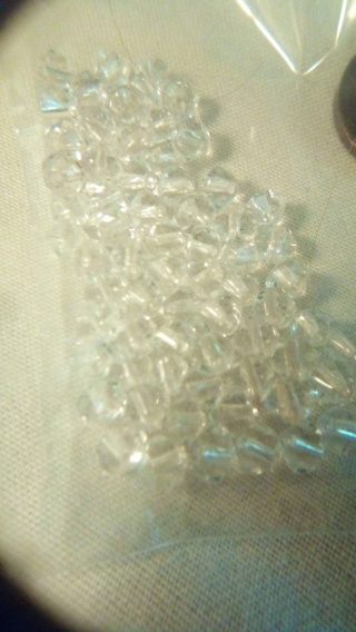 Little bag of clear glassy odd shaped beads