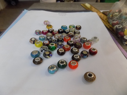 63 assorted Euro Beads most all different