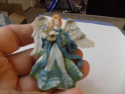 2 1/2 inch resin angel magnet dressed in blue & green gown playing harp glittery wings