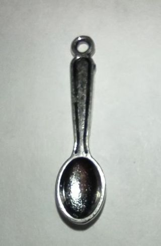 One silver tone small spoon charm