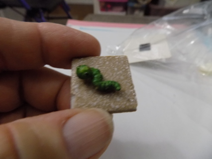 1 inch square ceramic tile with green caterpillar magnet
