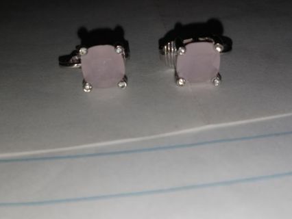 CLIP ON EARINGS. VERY PALE PINK IN COLOR.