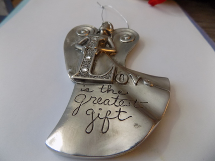 5 inch tall pewter angel ornament holds L in the word LOVE says love is the greatest gift