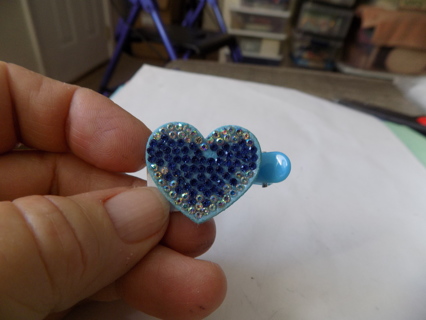 Blue heart shaped rhinestone covered clip on barrette