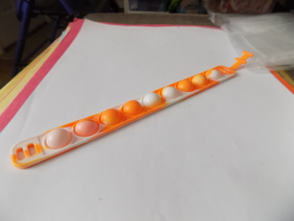 Orange pop it bracelet stress relief toy