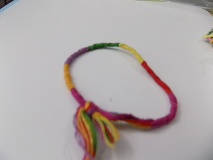 handmade braided thread friendship bracelet purplr, red,yellow,green