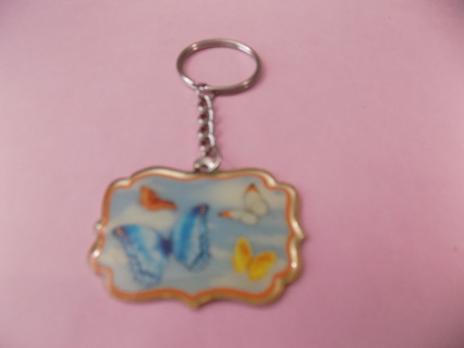 Butterfly enamel metal keychain says Nationwide Childrens on back