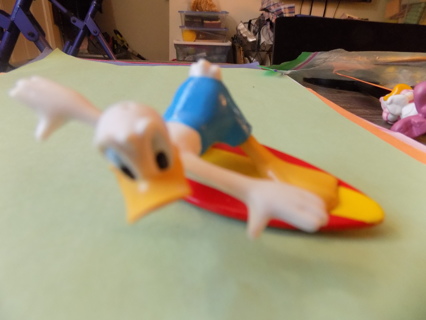 Donald Duck surfing on a surfboard pvc toy