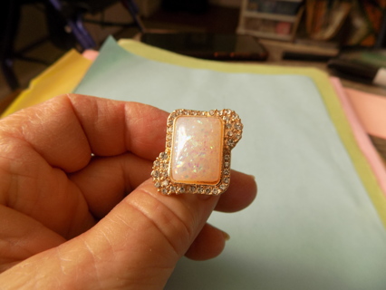 Adjustable goldtone large irredescent square stone surrounded in rhinestones