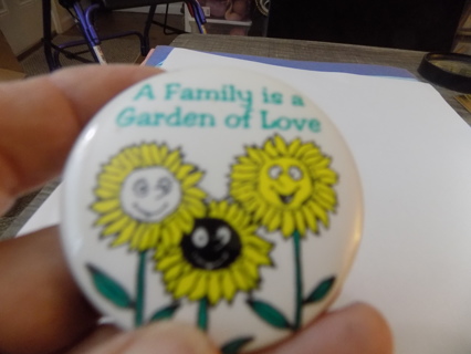 2 1/2 inch round A Family is a Garden of Love button badge with sunflowers