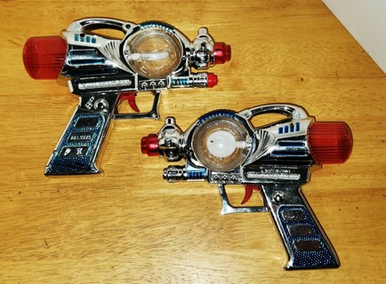 2 plastic hand-held space ray guns with lights & sounds