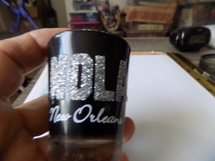 NOLA New Orleans shot glass black and shinning sparkes