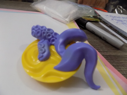 Plate of Star Wars Galactic Sookies Gragu purple with tentacles and suction cups on yellow base