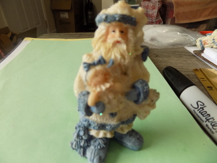 4 inch Father Christmas dressed in blue holds baby doll