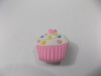 Croc shoe charm cupcake with pink wrapper, sprinkles