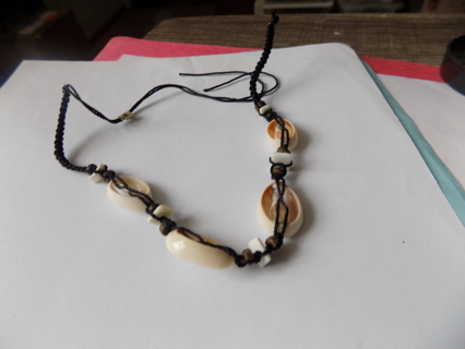 Sliced sea shells choker necklace on braided brown cord