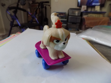 McDonalds toy Secret Life of Pets Daisy dog on purple skateboard