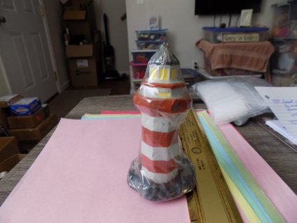 NIP stripped Lighthouse shaped candle